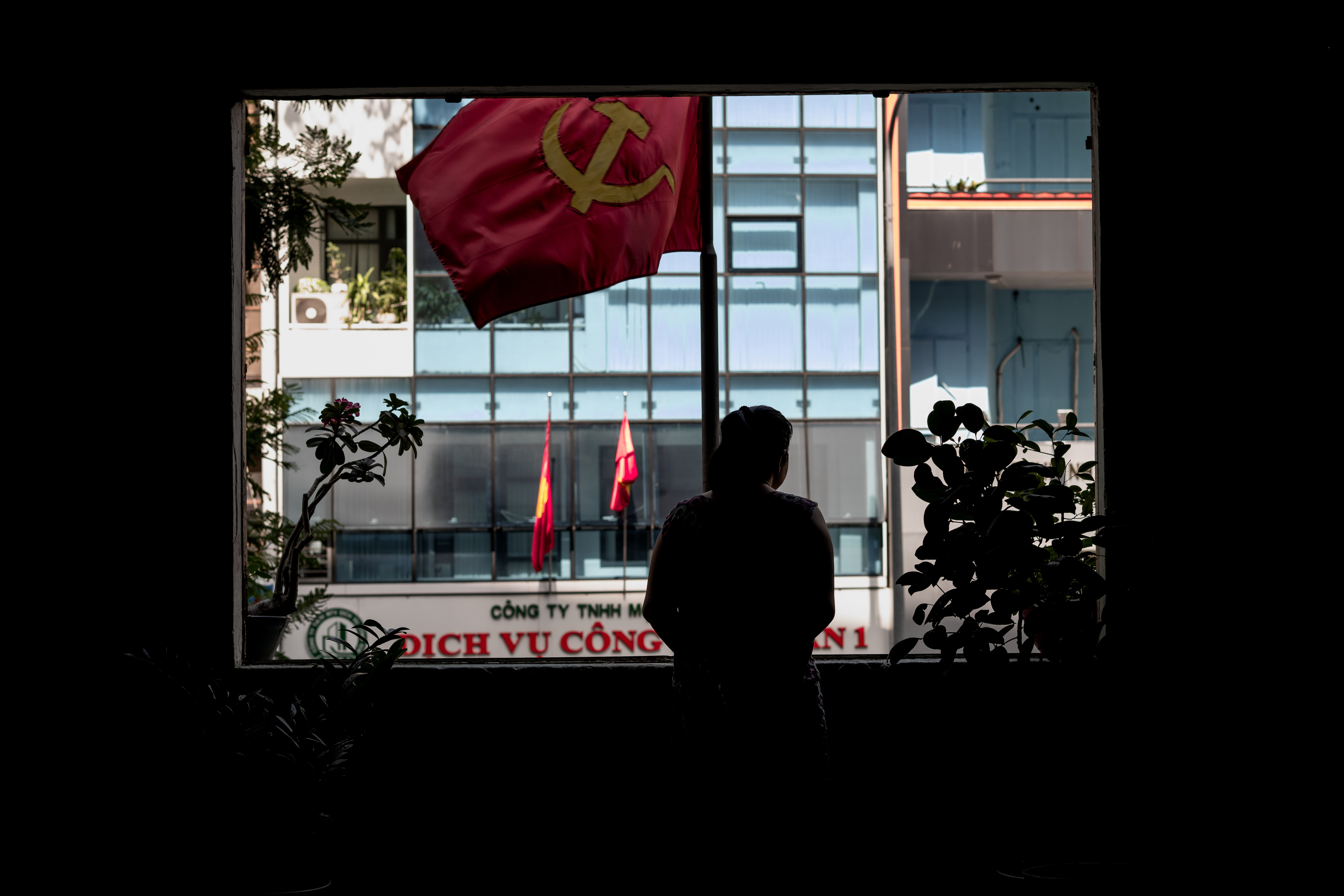 Silhouette of Person in Ho Chi Minh City Window · Free Stock Photo
