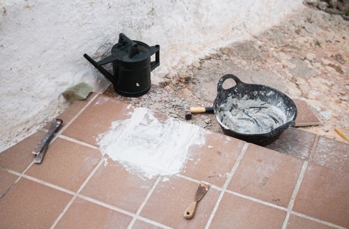 Free Construction tools and materials on tiled floor, Ciutadella de Menorca, Balearic Islands. Stock Photo