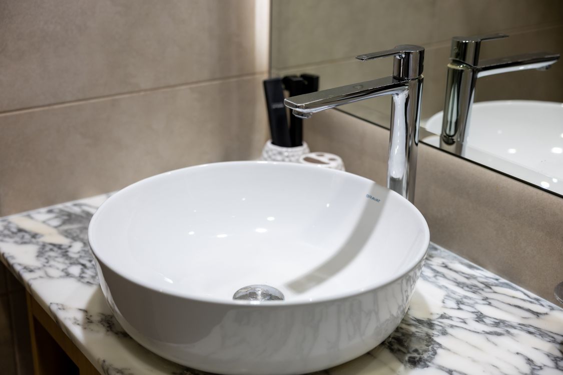 Elegant Modern Bathroom Sink with Marble Countertop · Free Stock Photo