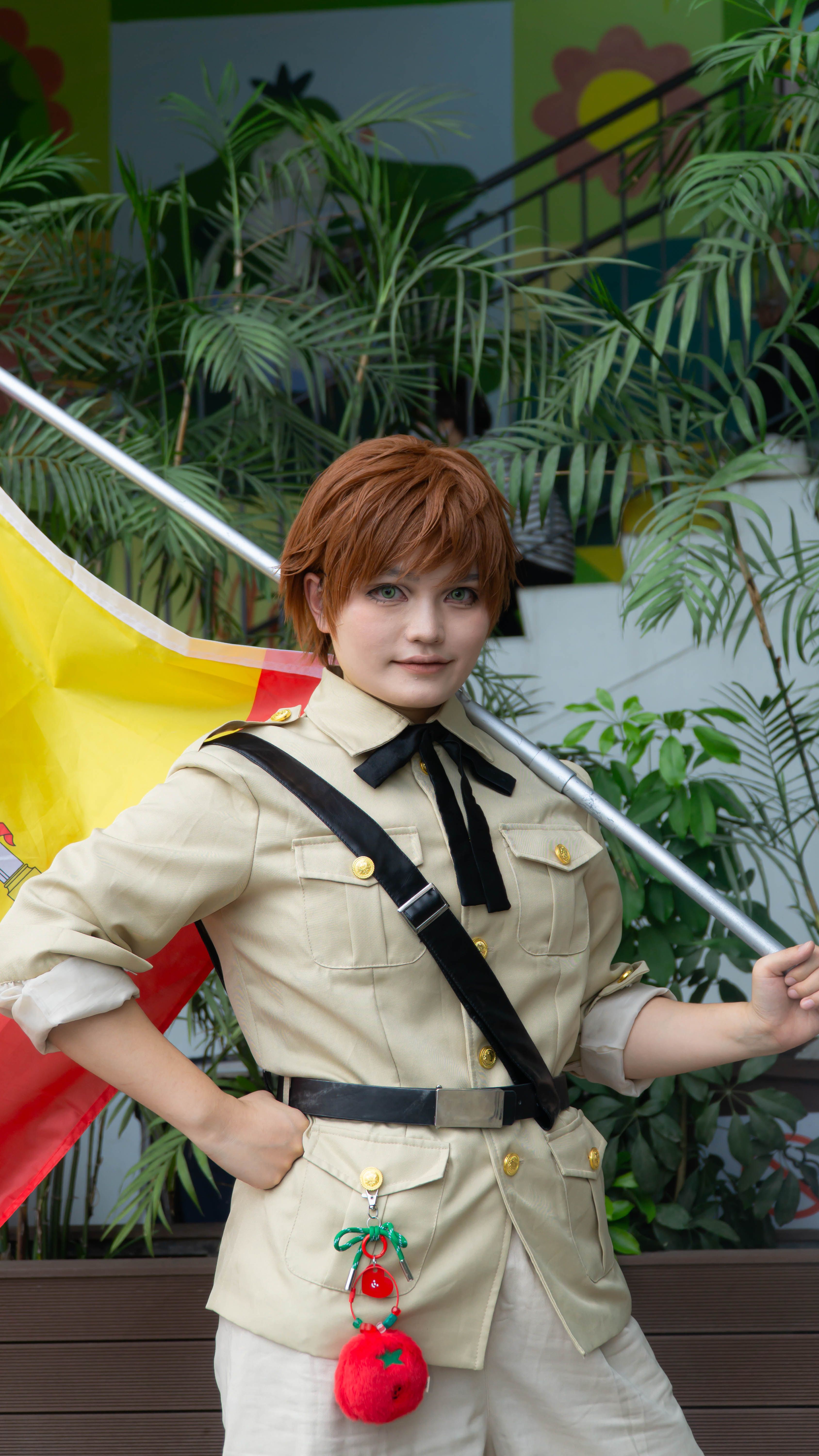 Confident Cosplayer in Khaki Uniform Holding Flag
