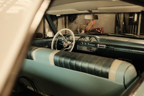 Free Interior view of a classic car showcasing a vintage dashboard and leather seats. Stock Photo