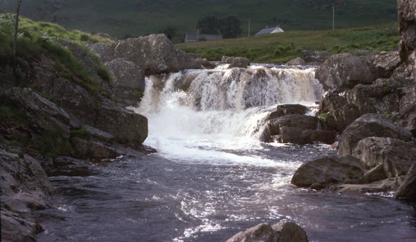 Cascading waterfall in the scenic Welsh countryside of the Brecon Beacons.