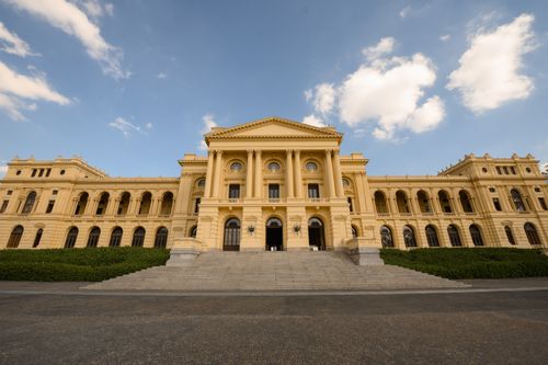 Free Stunning architectural front view of the São Paulo Museum of Ipiranga under a blue sky. Stock Photo