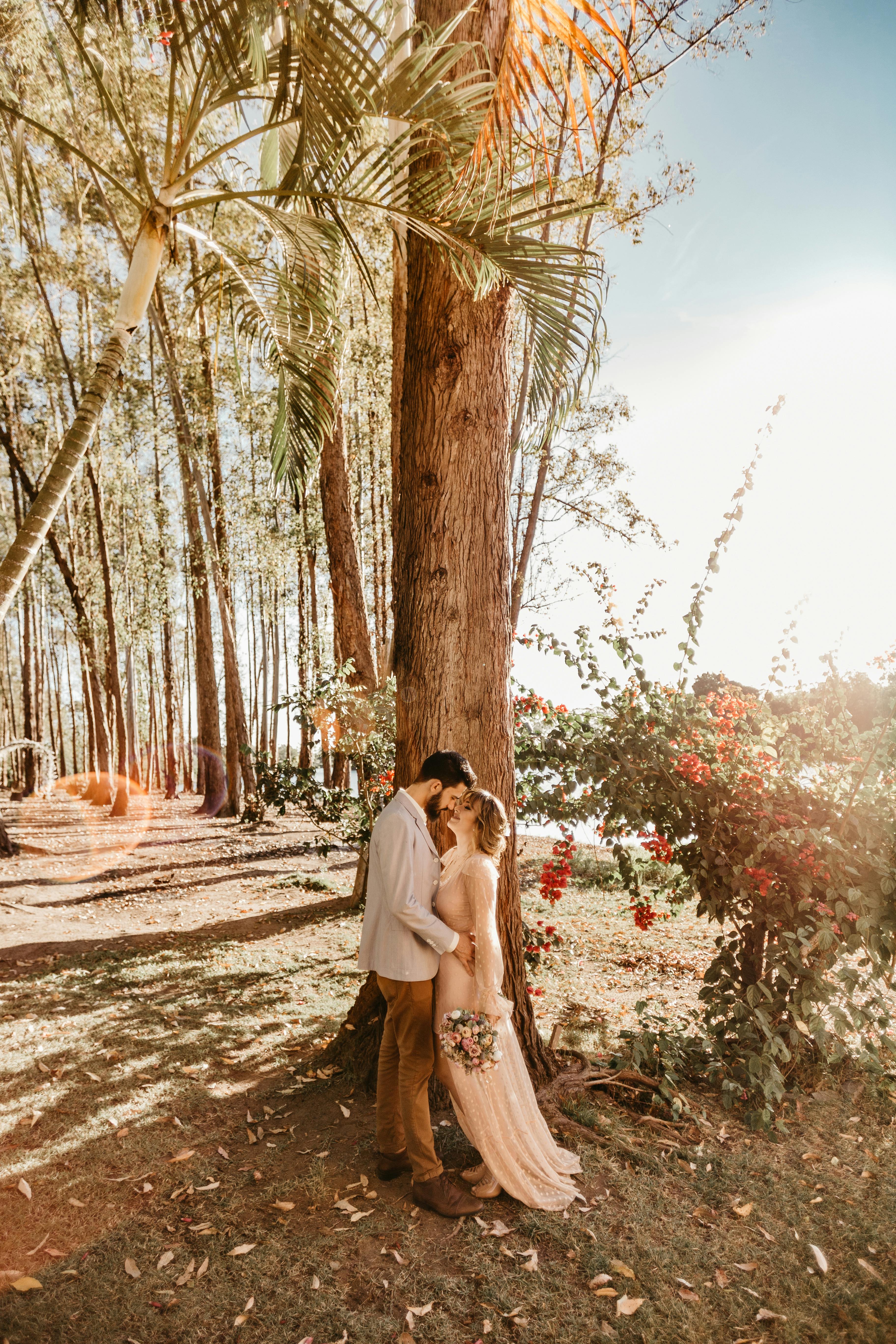 Cinematic wide shot of couple walking in botanical garden