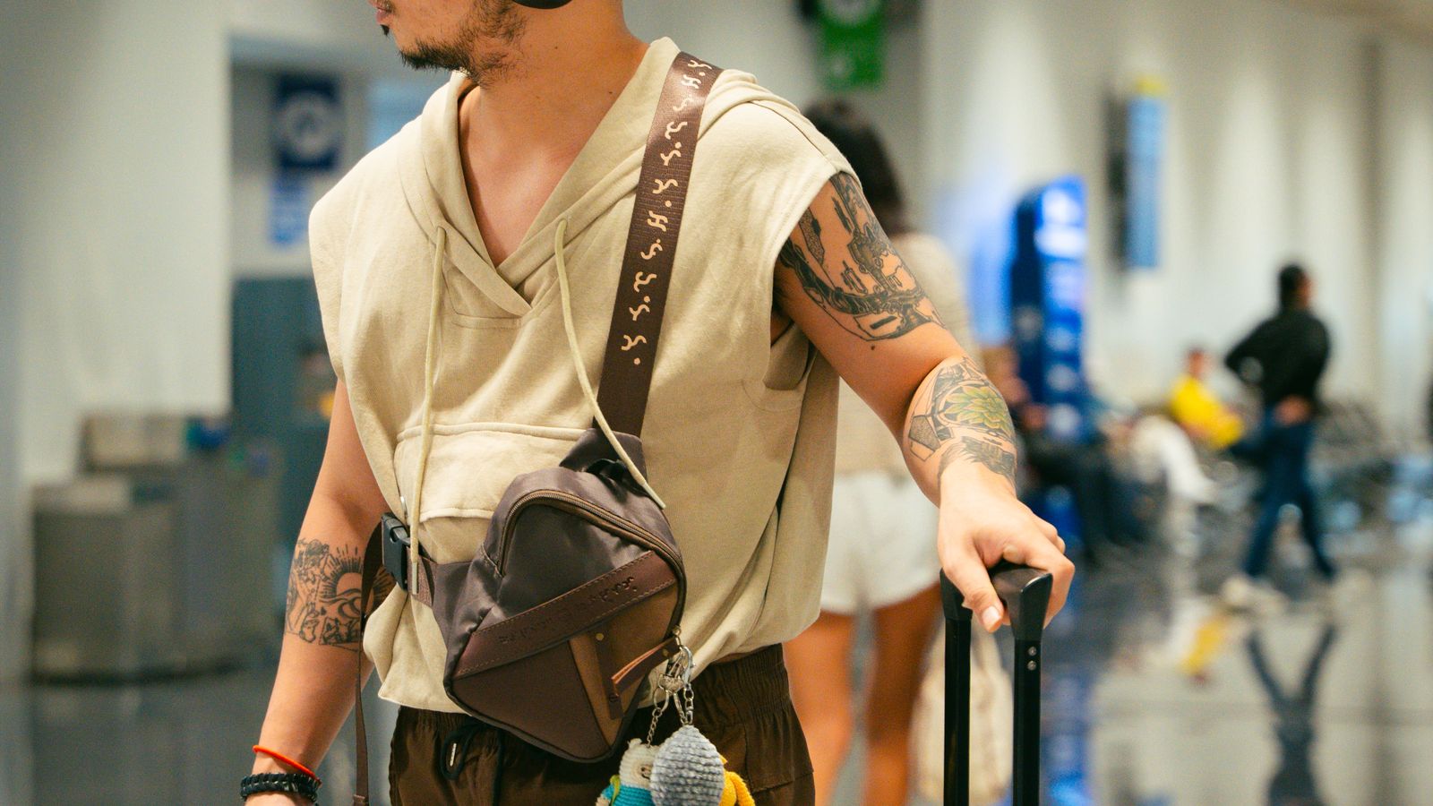 Traveler with a suitcase at an airport, representing the relocation process for teaching English abroad in Europe