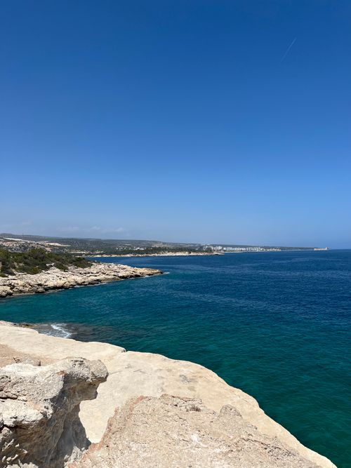 Free Breathtaking view of rocky coastline along the Mediterranean Sea with clear blue sky. Stock Photo