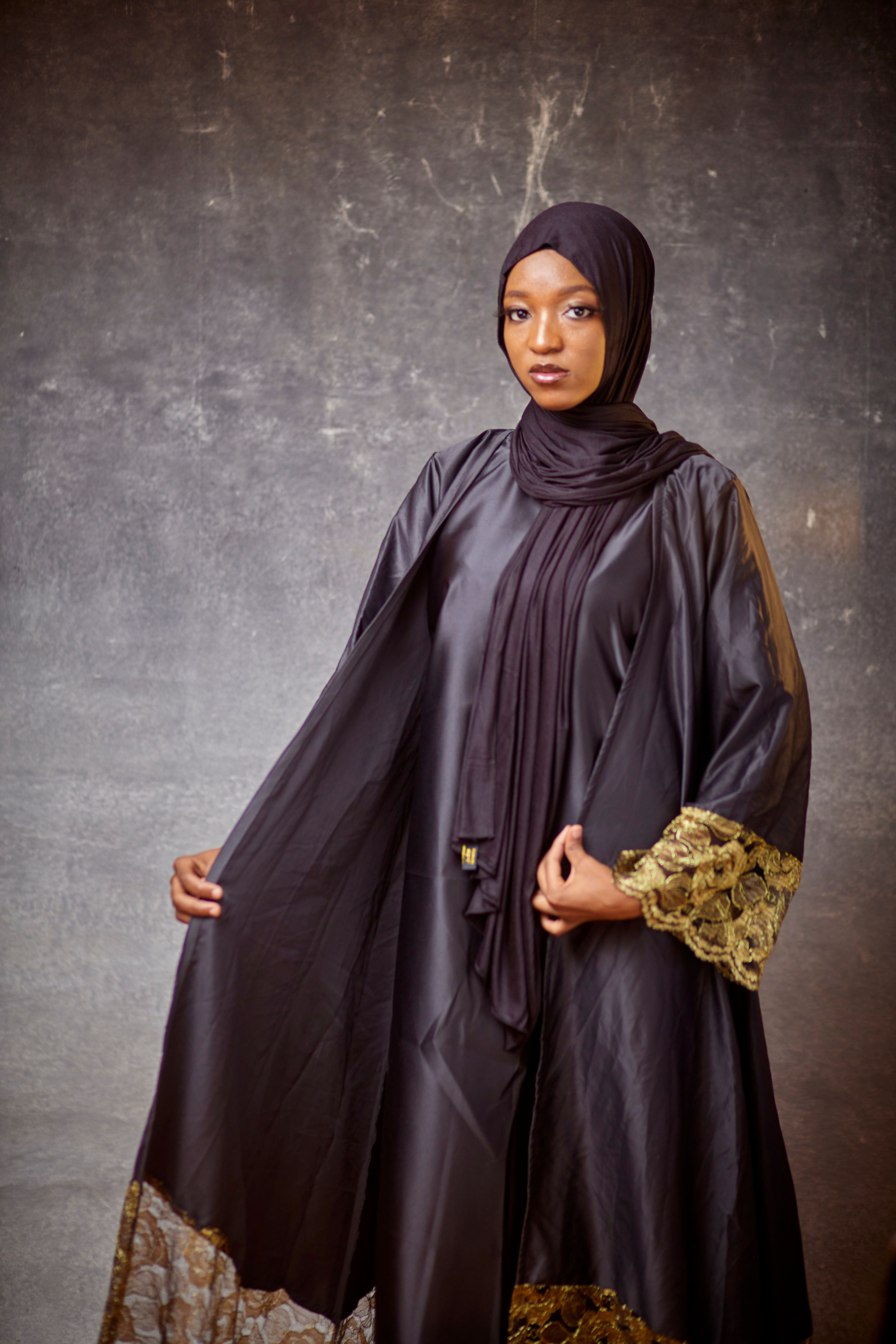 Portrait of a woman in a detailed abaya, representing our abaya trading category