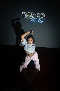 Energetic female dancer in urban attire performing at Danko Studio in Merida, Mexico.