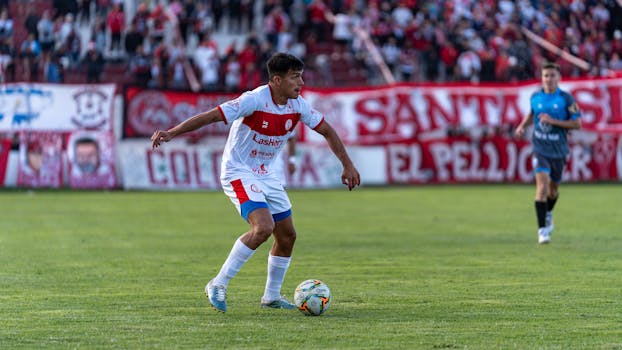 Photographer captures dynamic action during an outdoor soccer game.