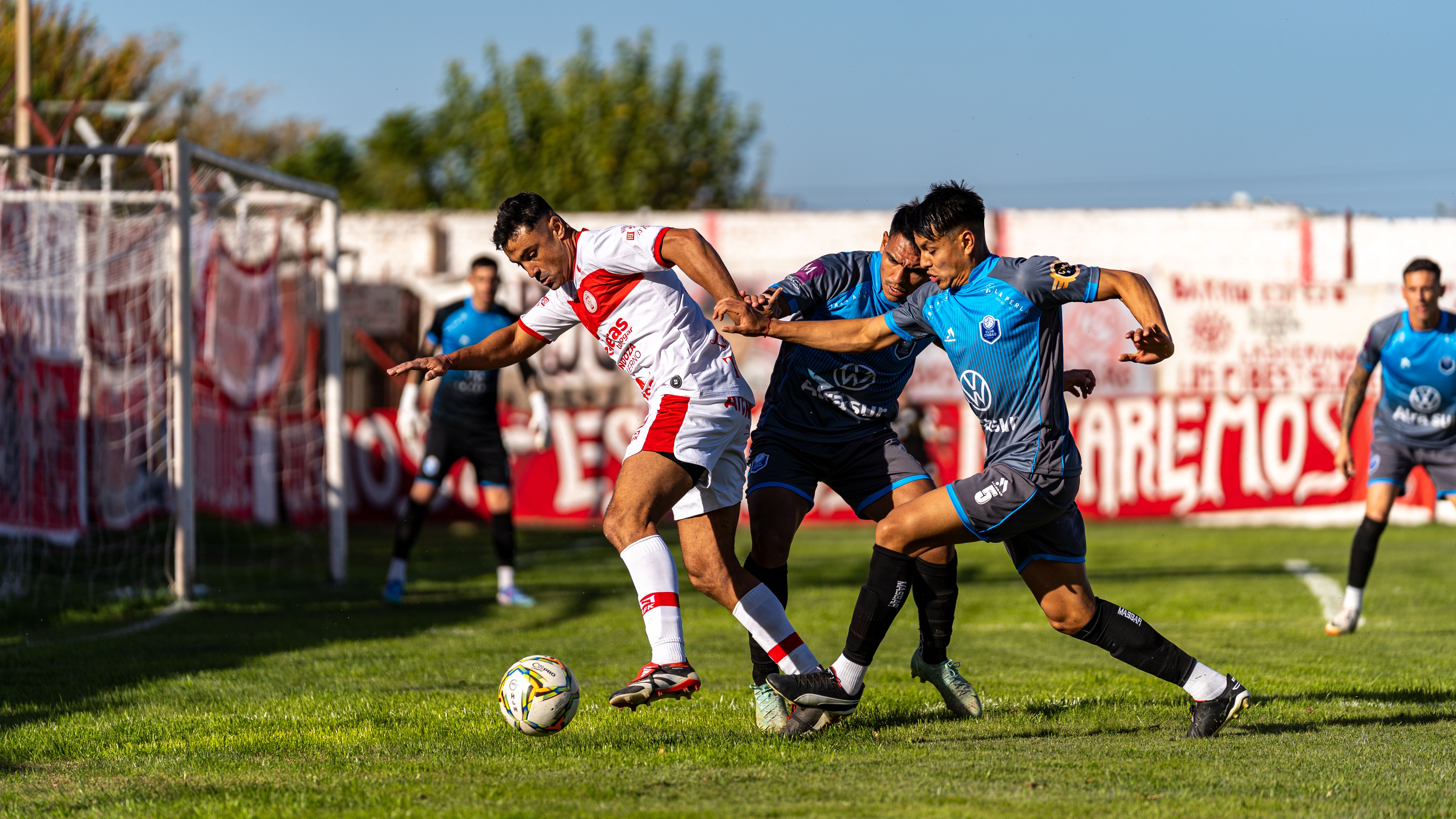 Intense Football Match Action Captured Mid-Game · Free Stock Photo