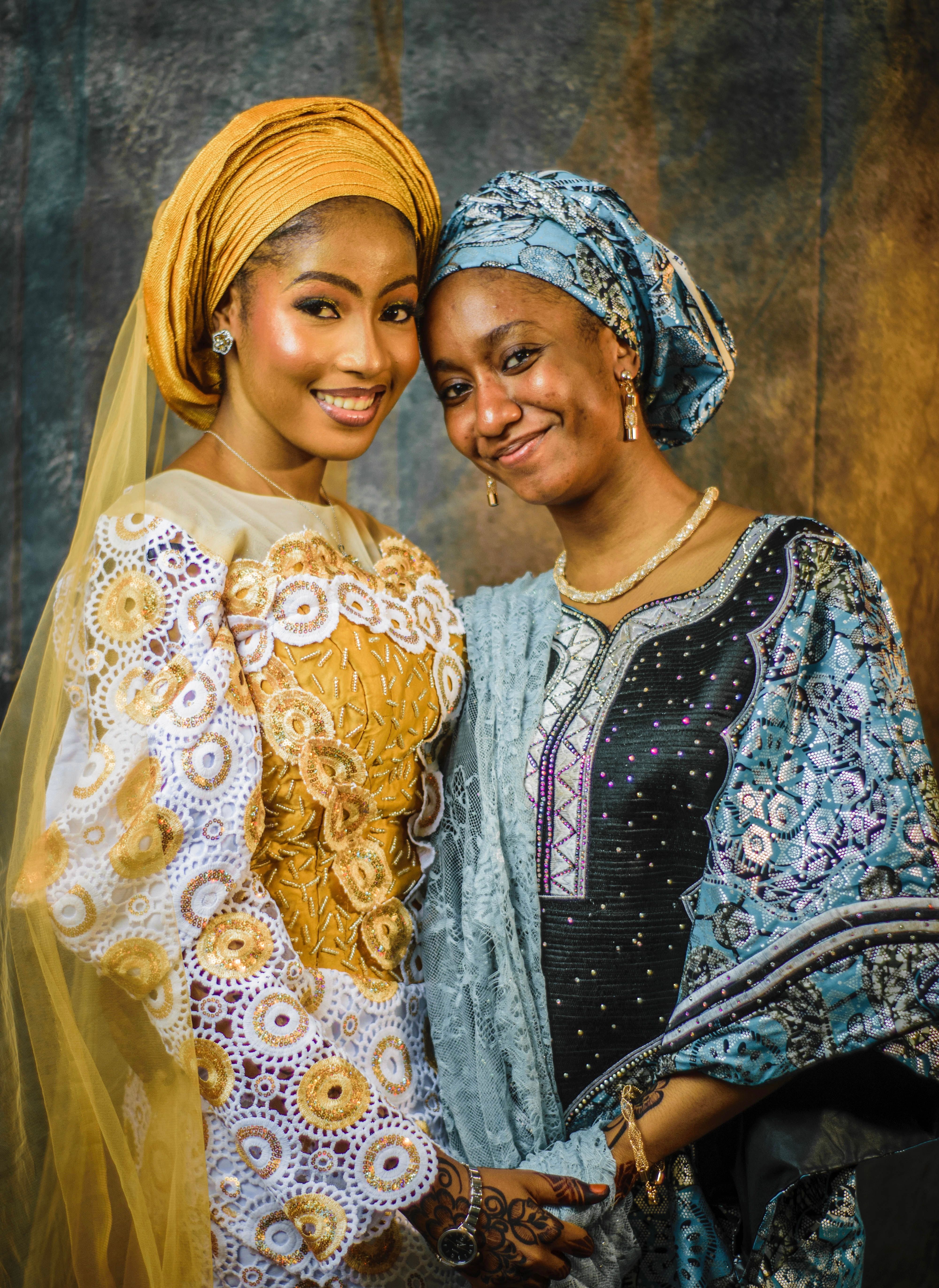 Elegant Traditional Attire Portrait of Two Women · Free Stock Photo