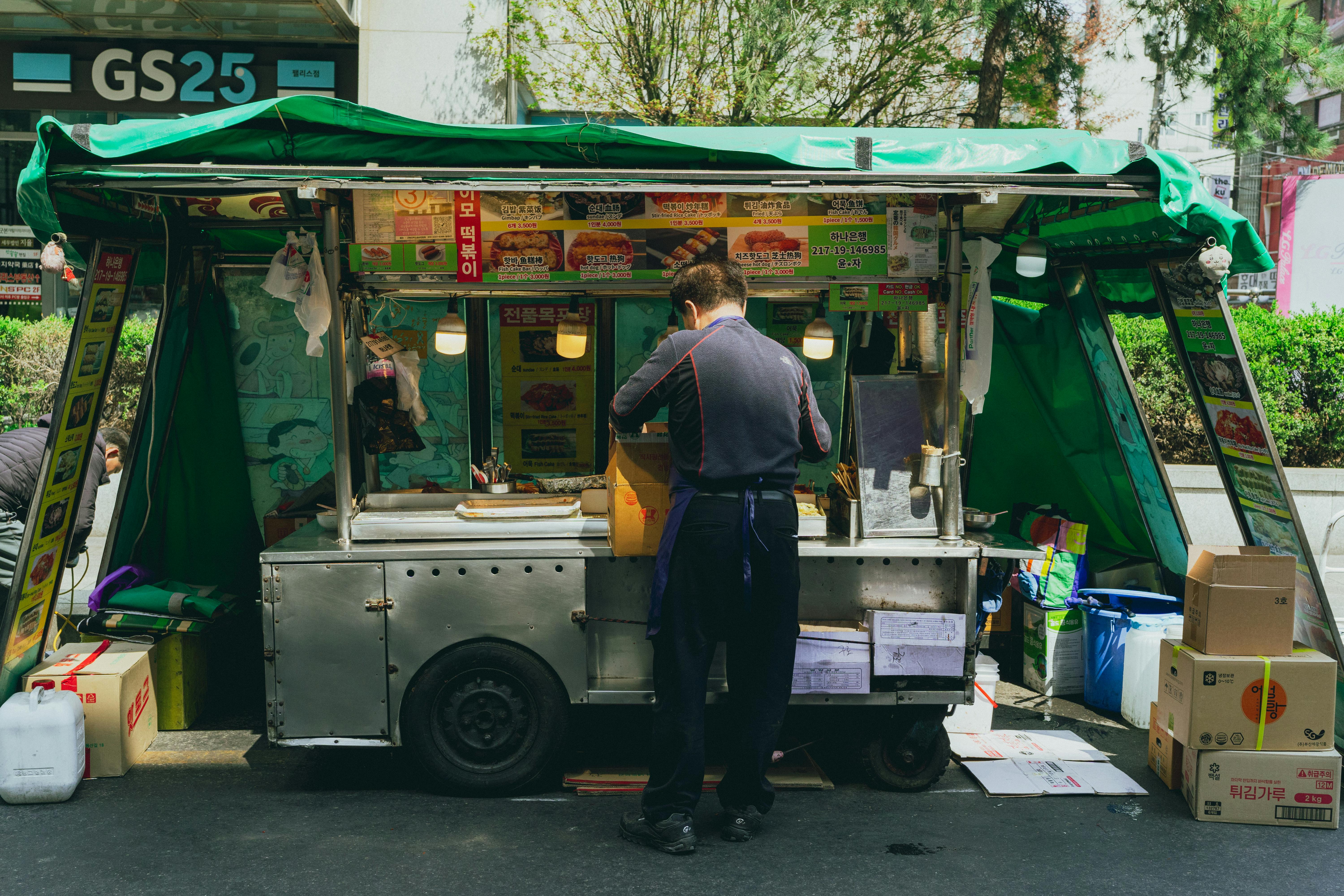 A bustling street food stall in Seoul, capturing the lively urban atmosphere and Korean street cuisine.
