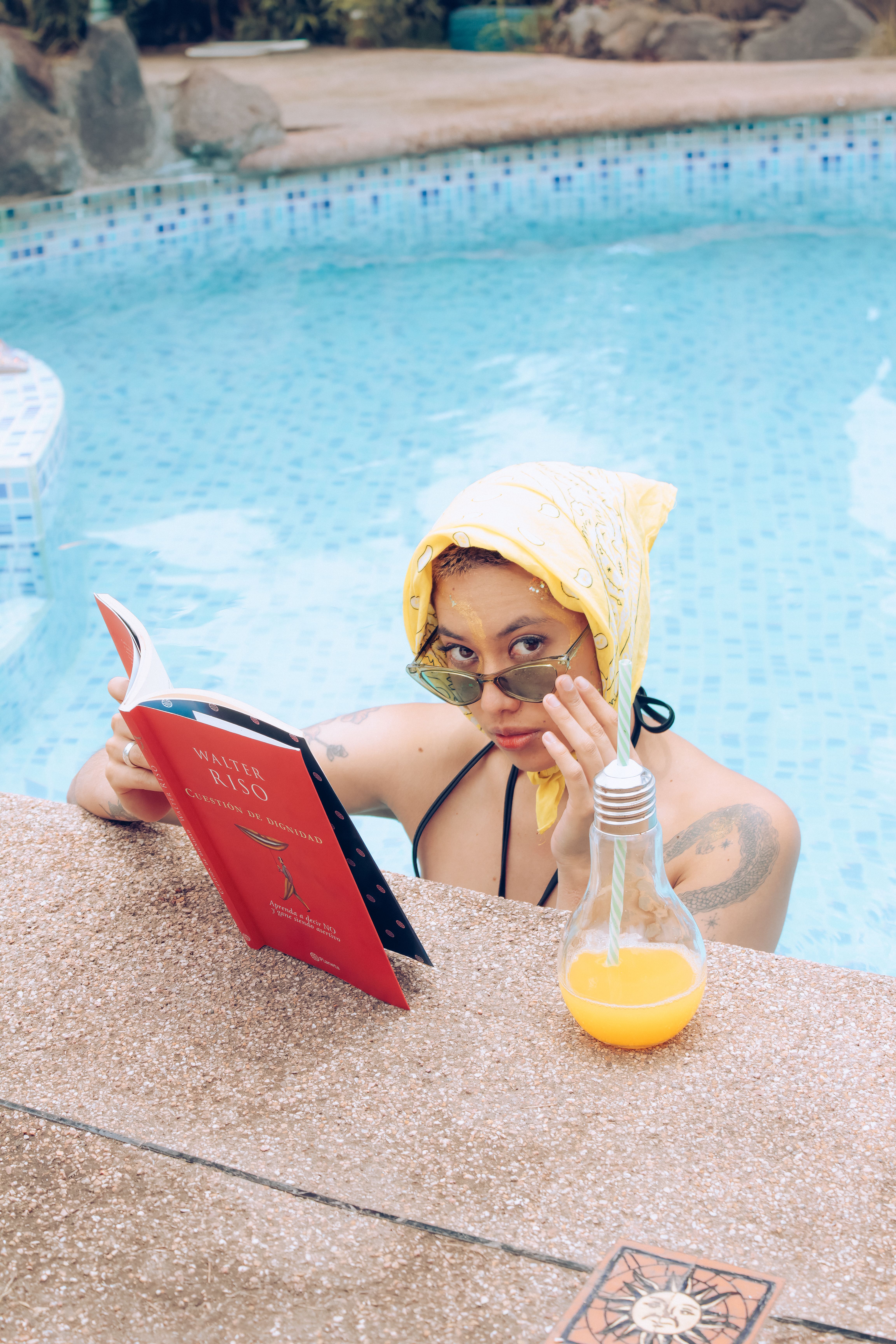 Woman Relaxing by Pool Reading a Book · Free Stock Photo