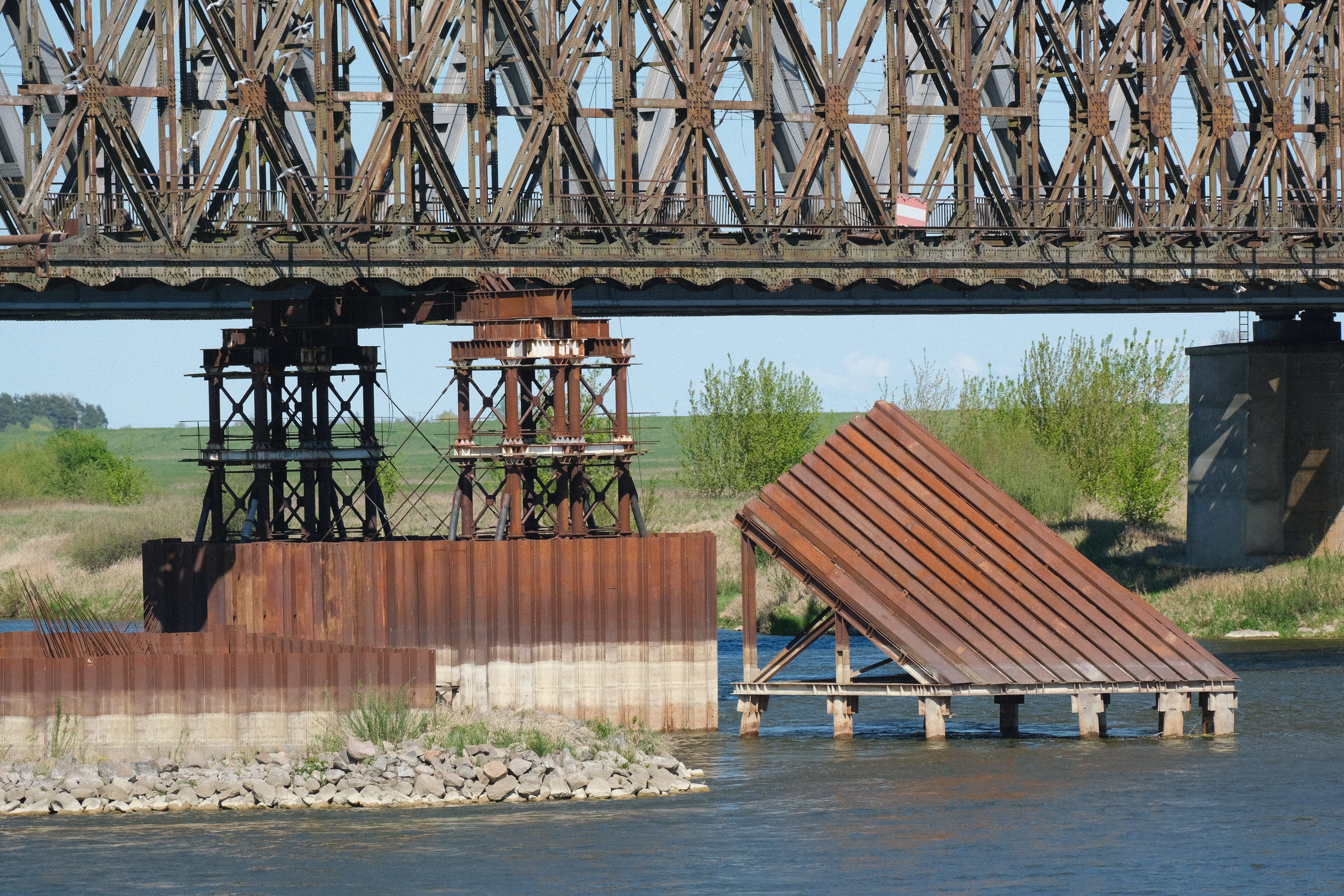 Rustic Industrial Bridge Over Calm River Waters · Free Stock Photo
