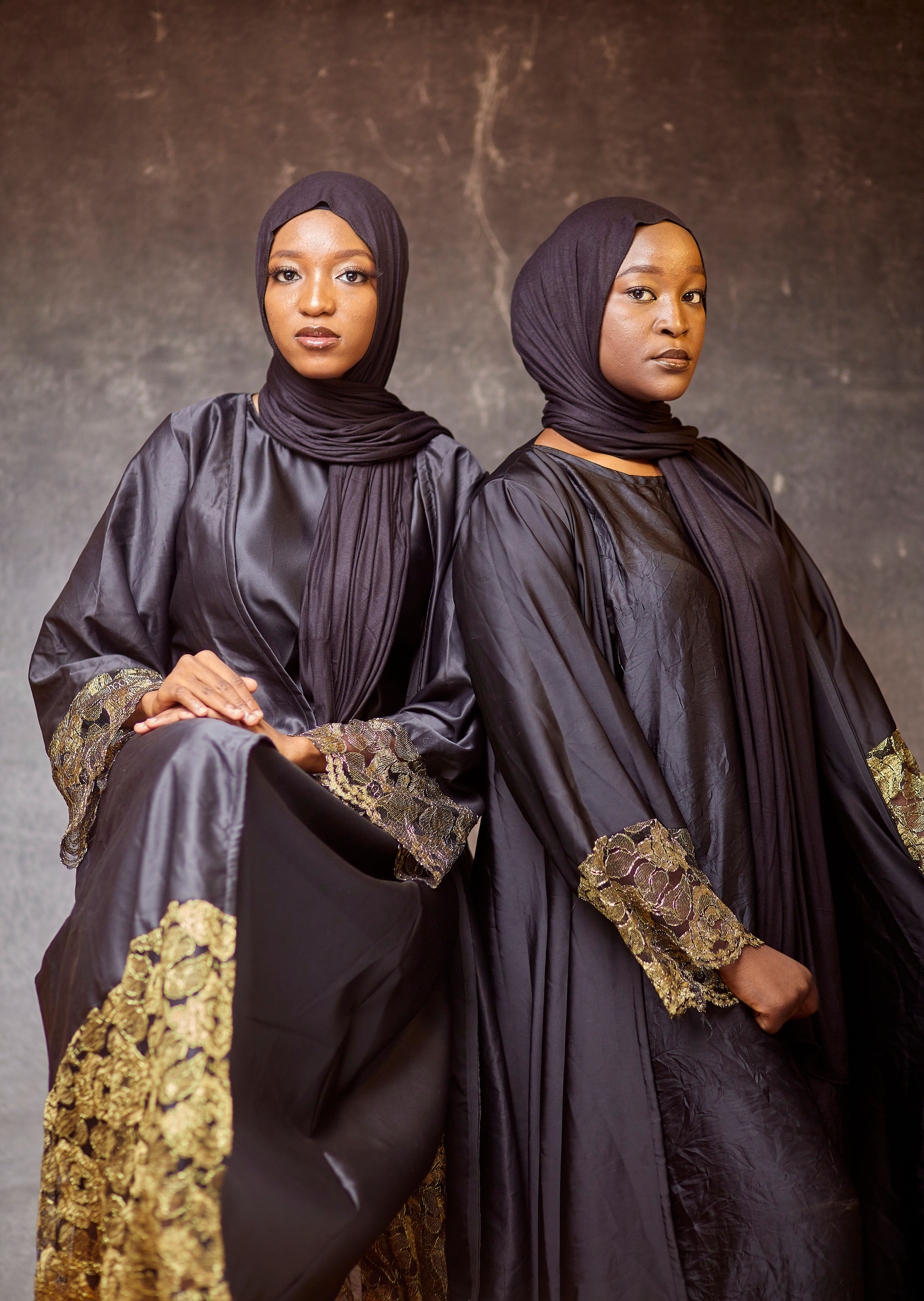 Elegant Portrait of Two Women in Traditional Attire · Free Stock Photo