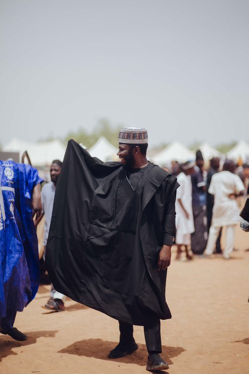 Free A vibrant display of Nigerian traditional attire during a cultural festival outdoors. Stock Photo