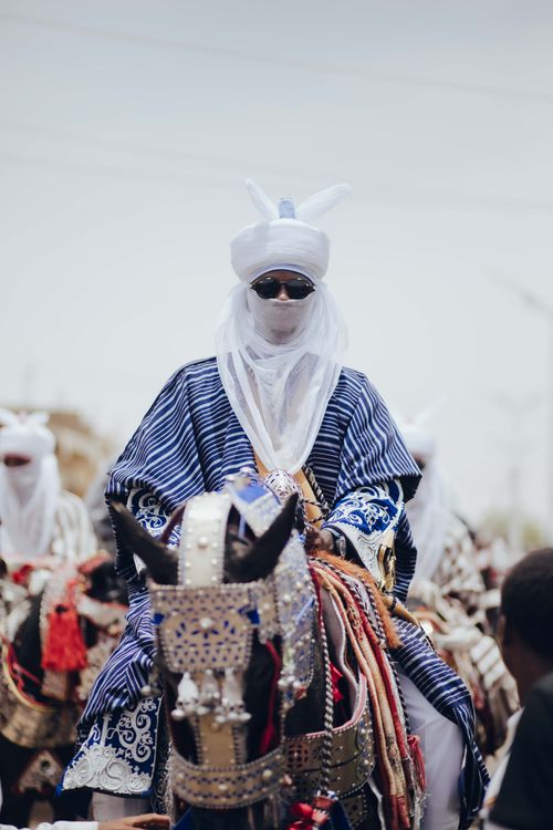 Free A Nigerian horseman in traditional attire participates in a cultural festival. Stock Photo
