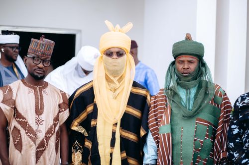 Free Men in traditional Nigerian attire gather for a cultural event, showcasing vibrant designs and patterns. Stock Photo
