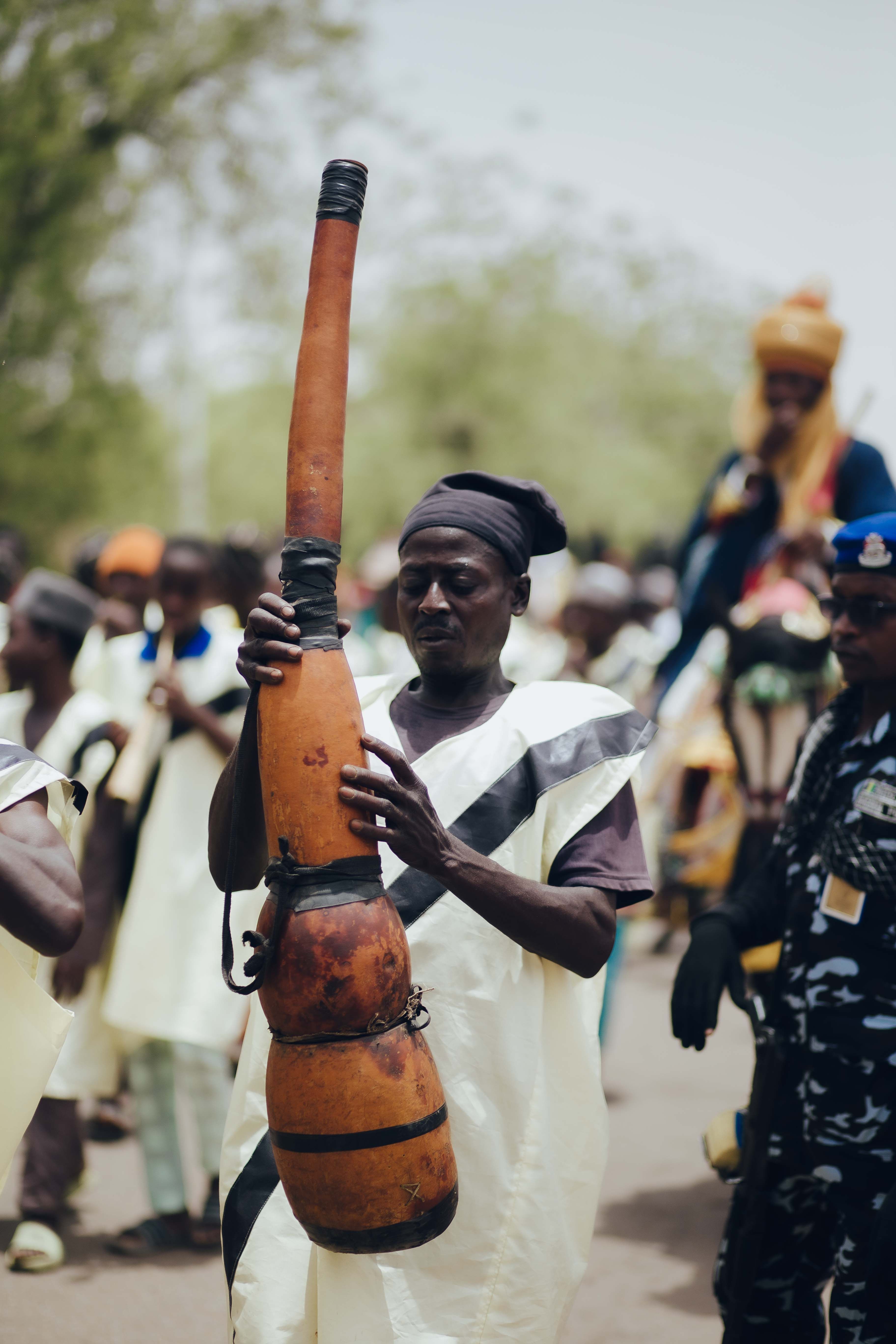 Nigerian Festival Parade with Traditional Instrument · Free Stock Photo