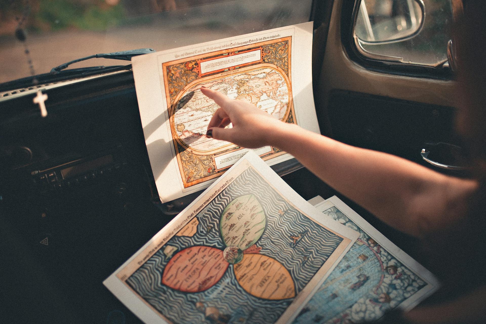 Person Inside A Vehicle Pointing On A Map