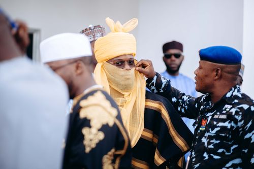 Free Men in traditional Nigerian attire during a cultural event highlighting diversity and tradition. Stock Photo