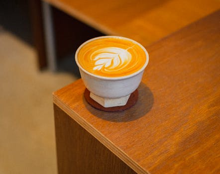 Capture of a beautifully crafted latte art in a cozy Shinjuku café in Tokyo.