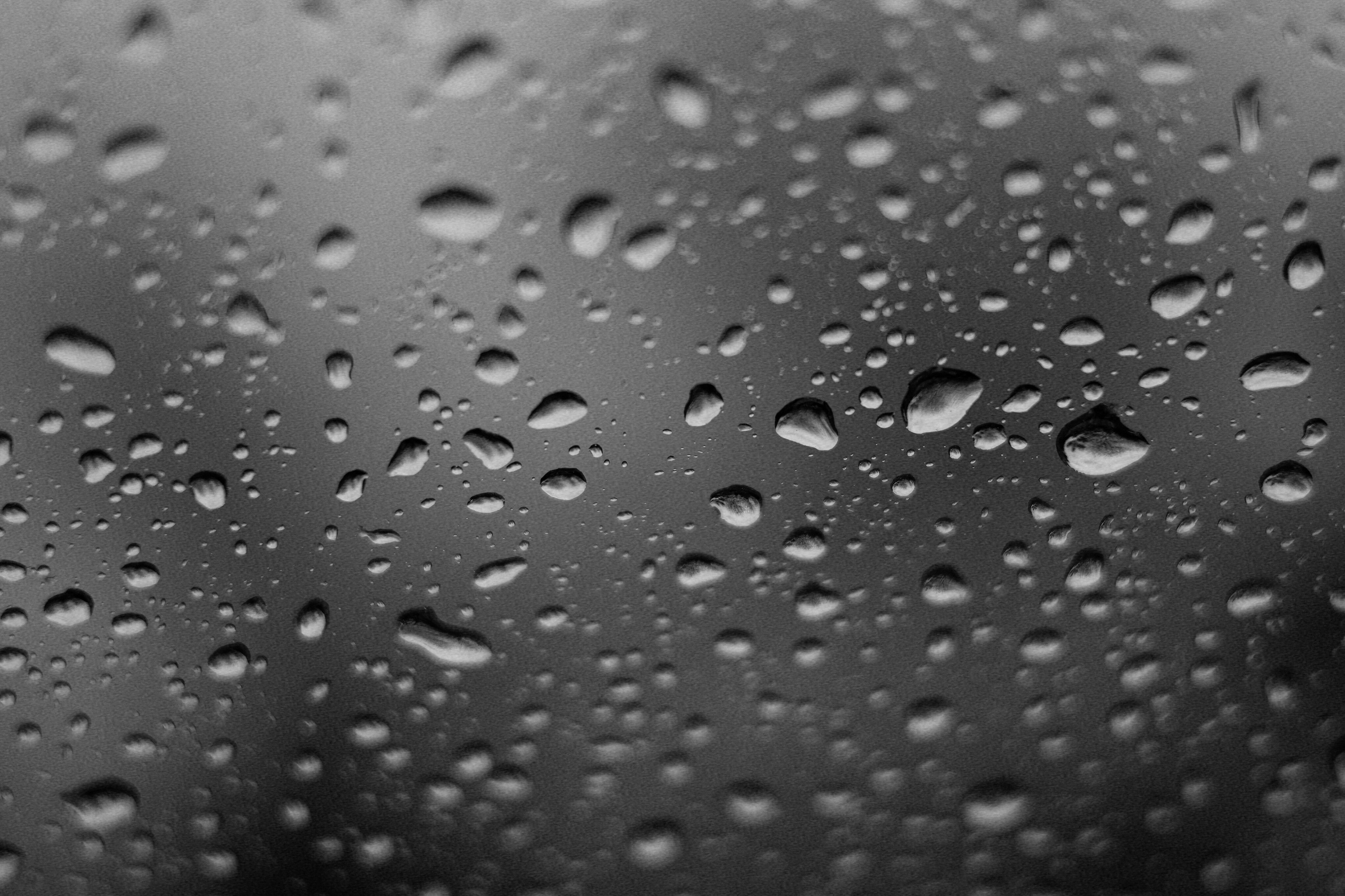 Close-up of Water Droplets on Glass Window · Free Stock Photo