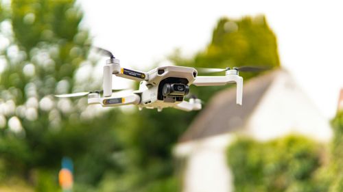 Free A drone captures aerial views amidst vibrant nature in Brugge, Belgium. Stock Photo