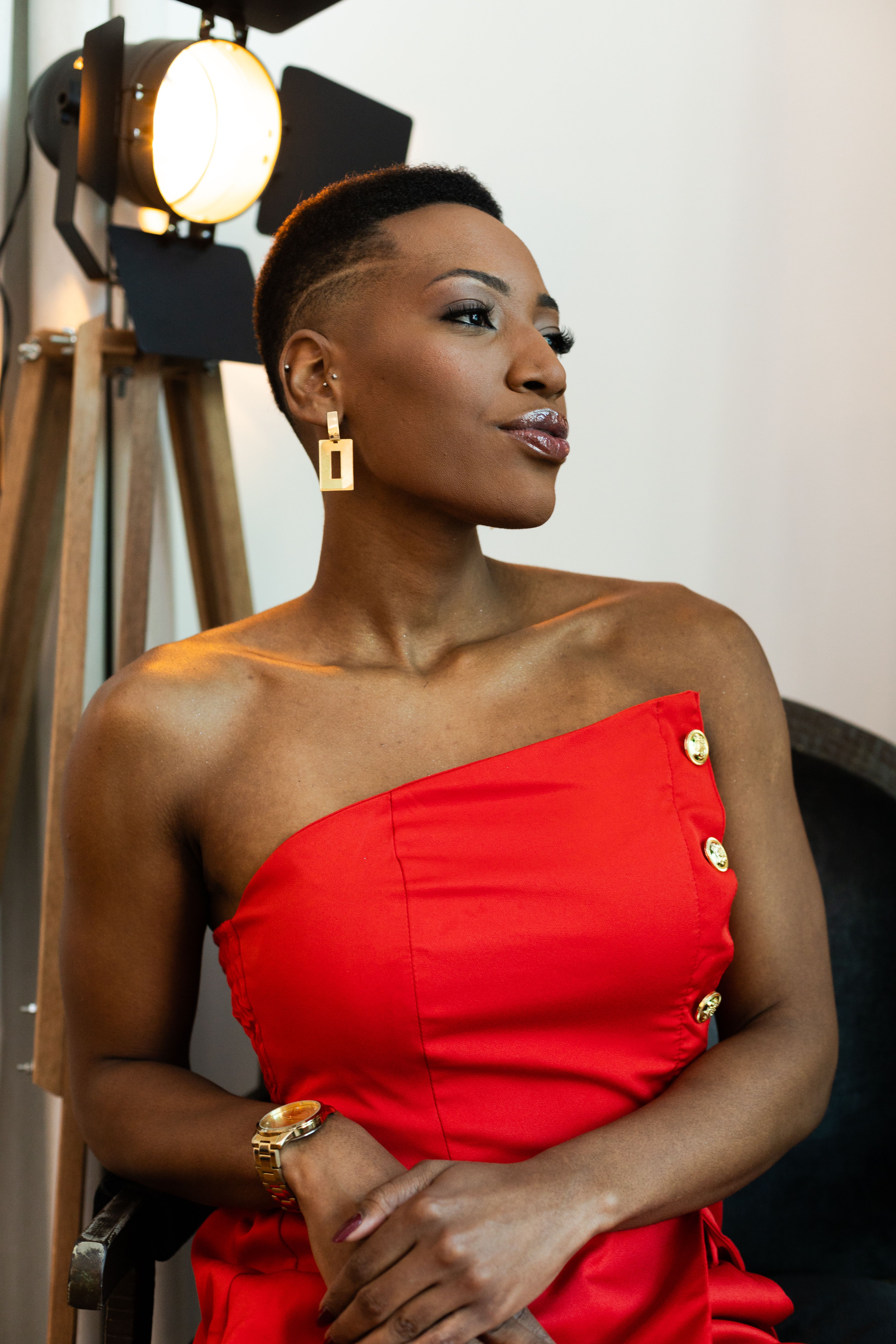 Elegant Woman in Red Dress Posing Indoors · Free Stock Photo