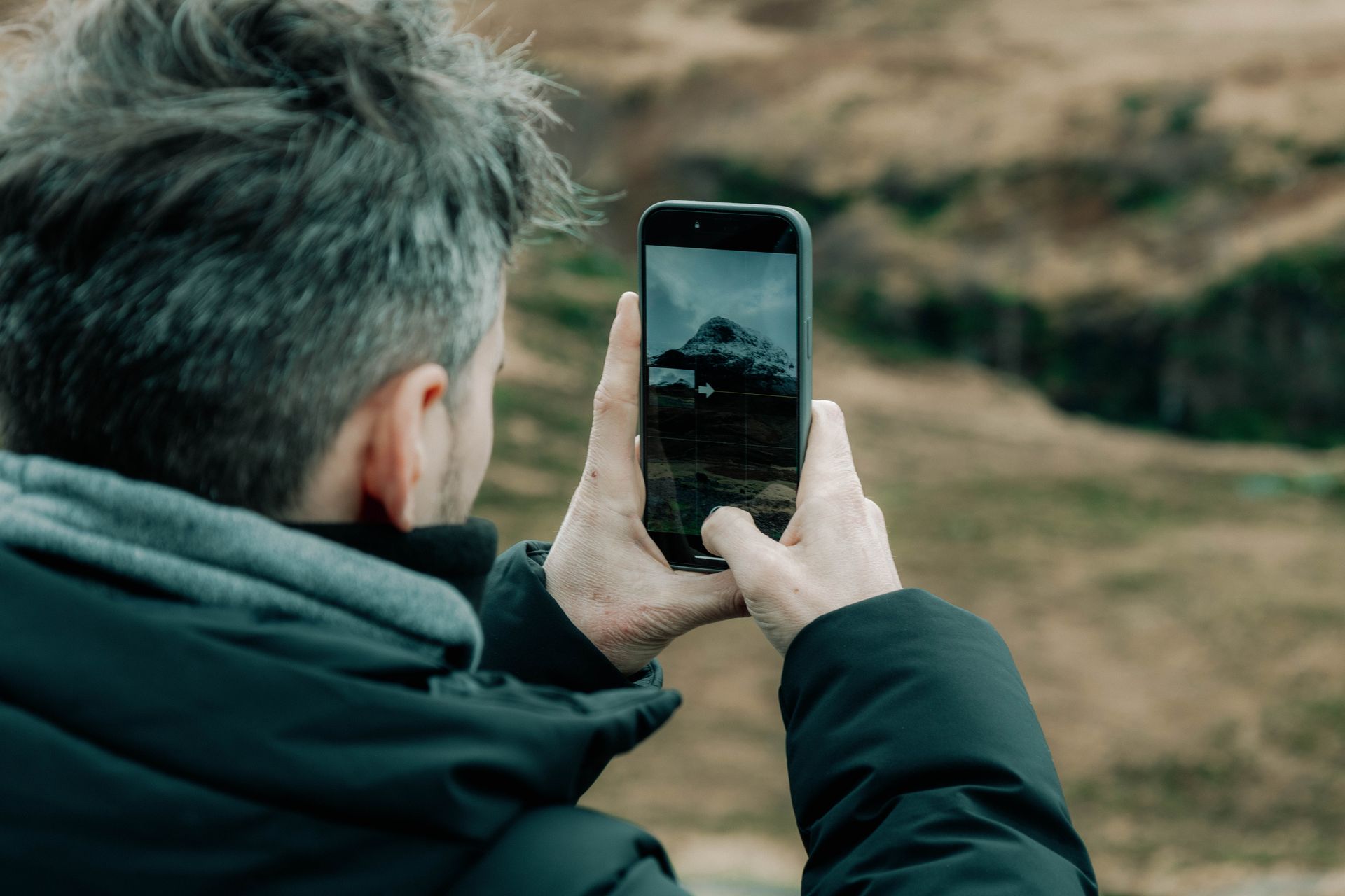 Photographer captures stunning mountain view in Edinburgh, Scotland on smartphone outdoors.