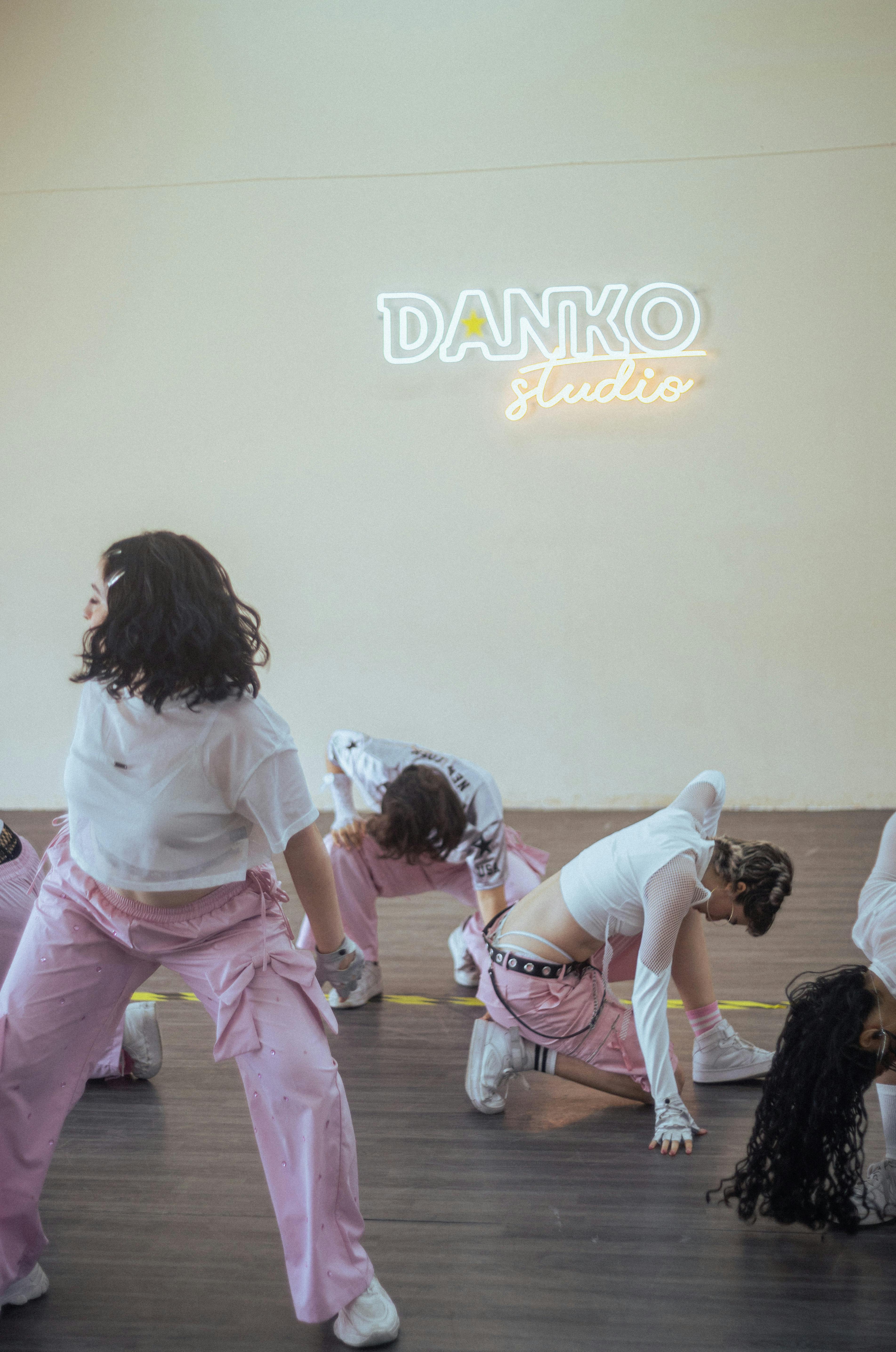 Energetic dance practice session held indoors at Danko Studio, showcasing dynamic moves.