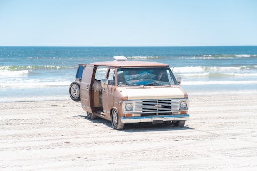 Retro van on a sandy beach in Corpus Christi, Texas on a sunny day, perfect for travel and leisure.