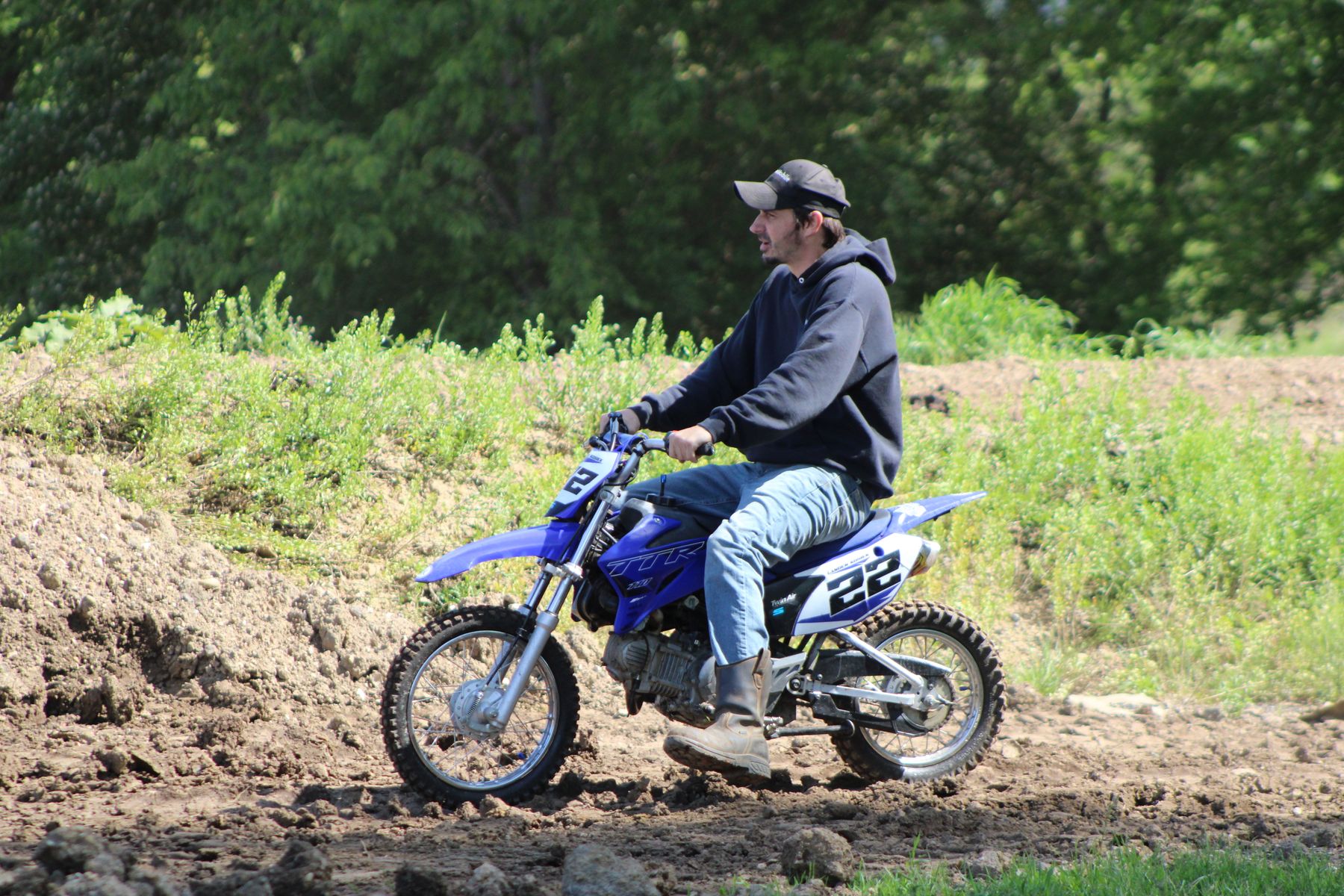 Motocross rider on a blue dirt bike