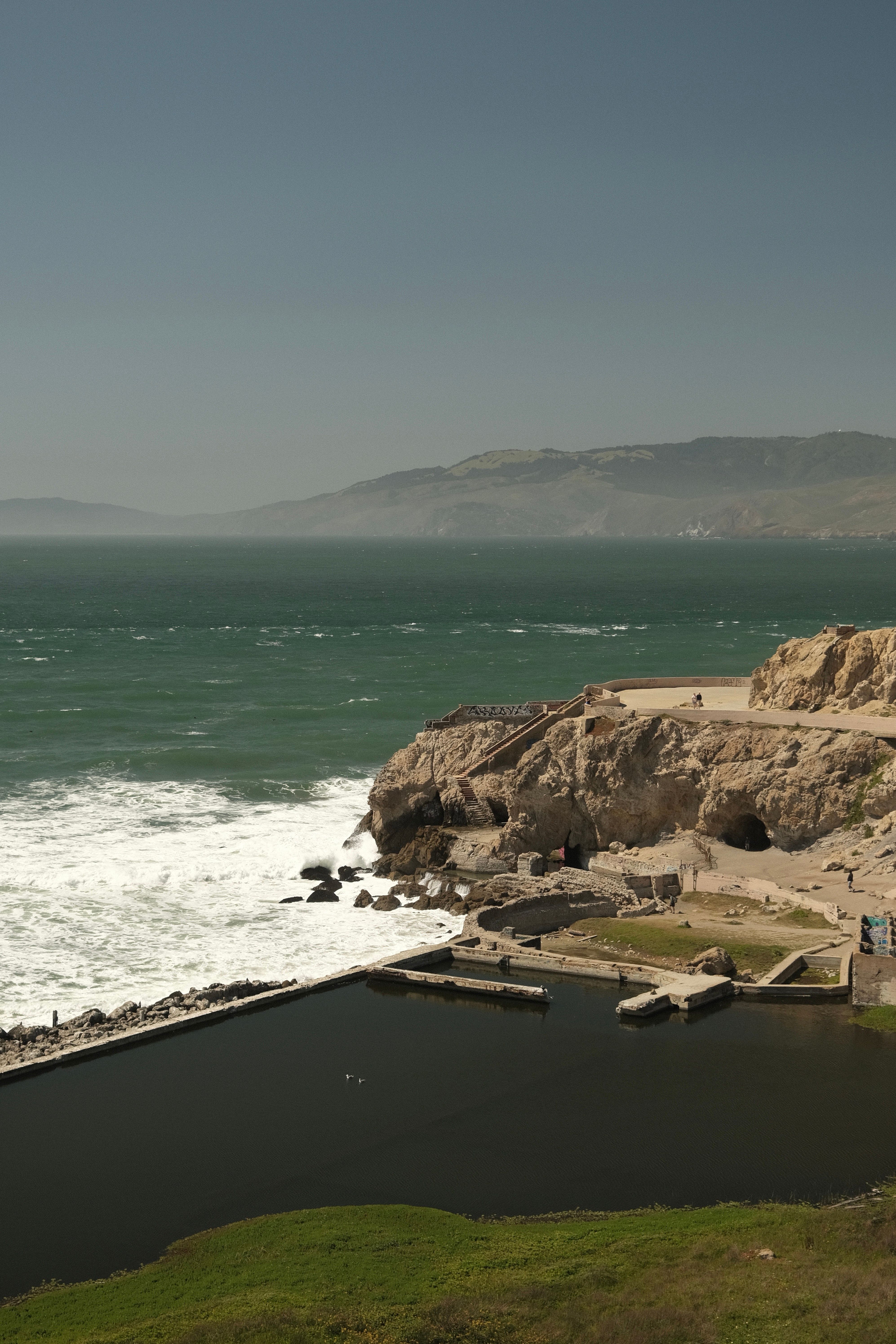 Explore the historic Sutro Baths ruins along the rugged coastline of San Francisco, California.