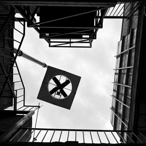 Free Black and white view of industrial architecture forming geometric patterns against the sky in Tehran, Iran. Stock Photo