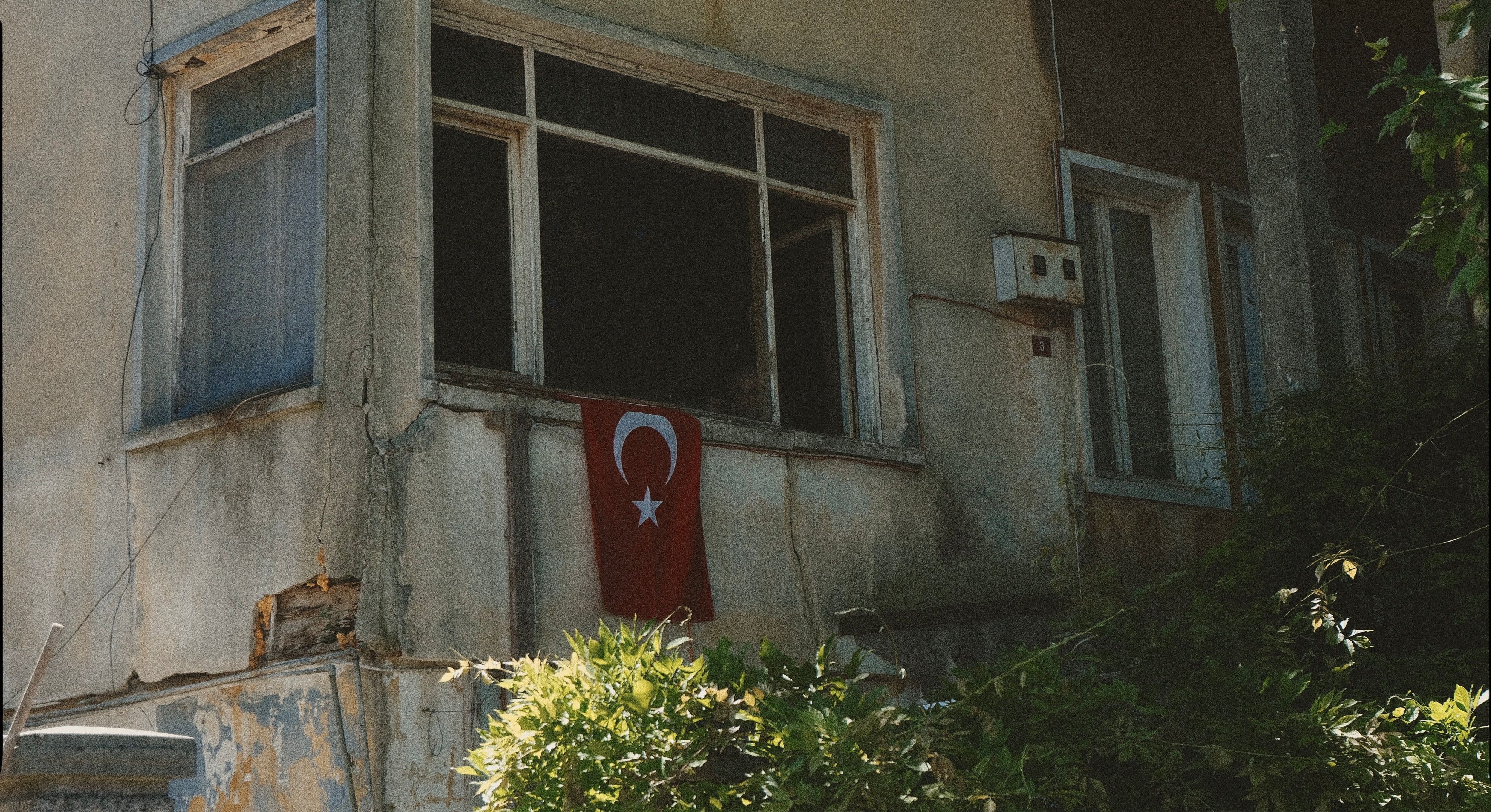 Weathered Building with Turkish Flag in Window · Free Stock Photo