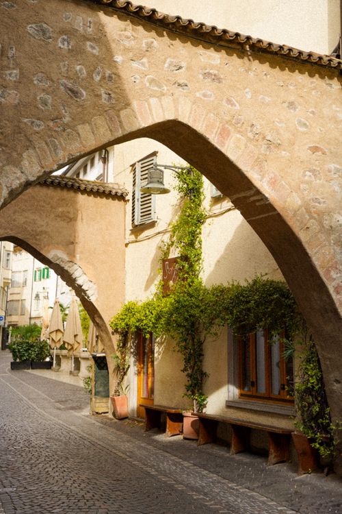 Free Beautiful historic architecture in Merano, Italy with warm summer vibes and vintage charm. Stock Photo