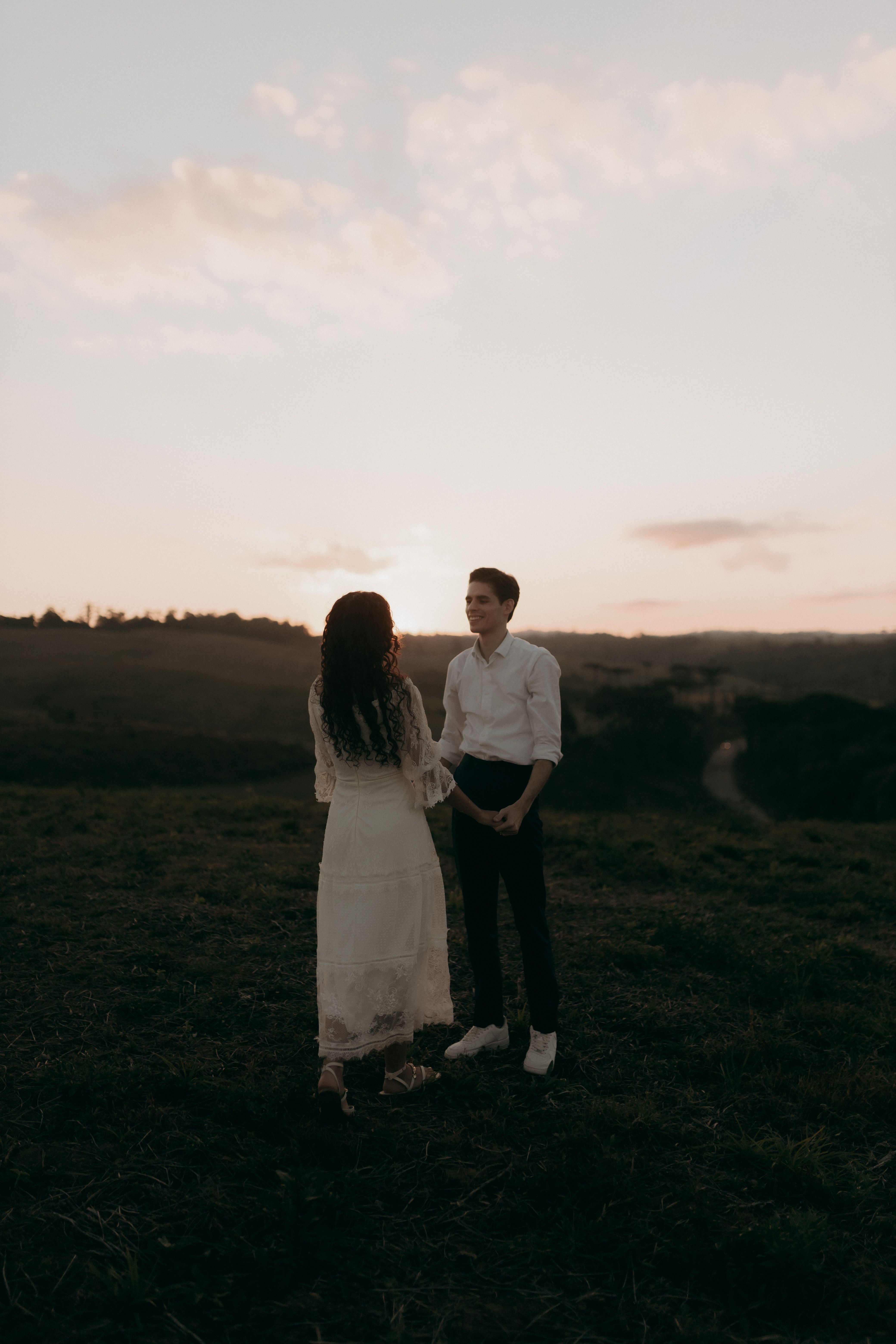 Romantic Couple at Sunset on Hilltop · Free Stock Photo