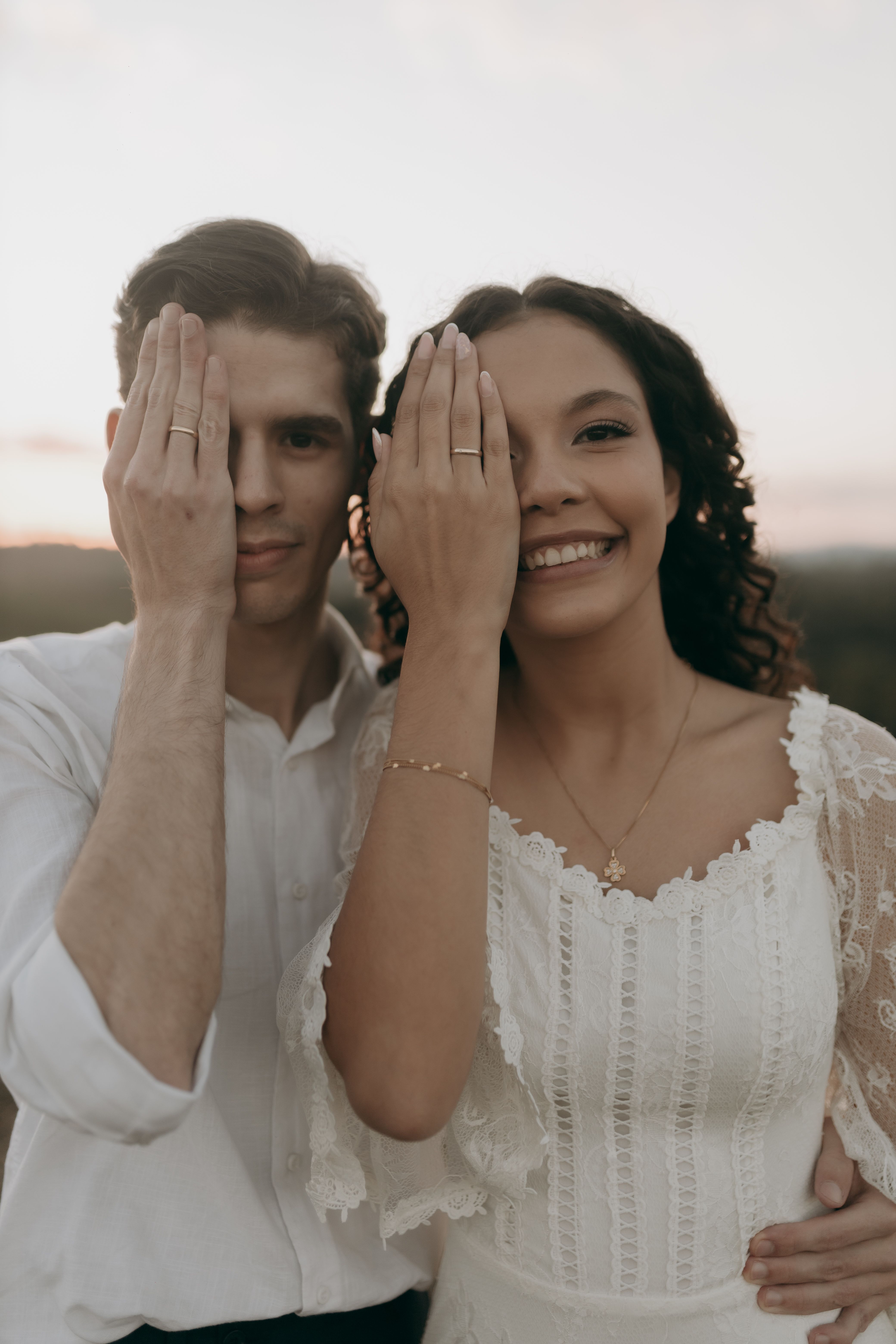 Romantic Couple at Sunset with Playful Poses · Free Stock Photo