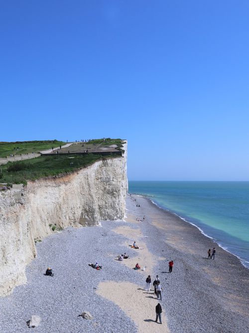 Free Explore the stunning white cliffs and pebble beach of Birling Gap, a scenic highlight on England's coastline. Stock Photo