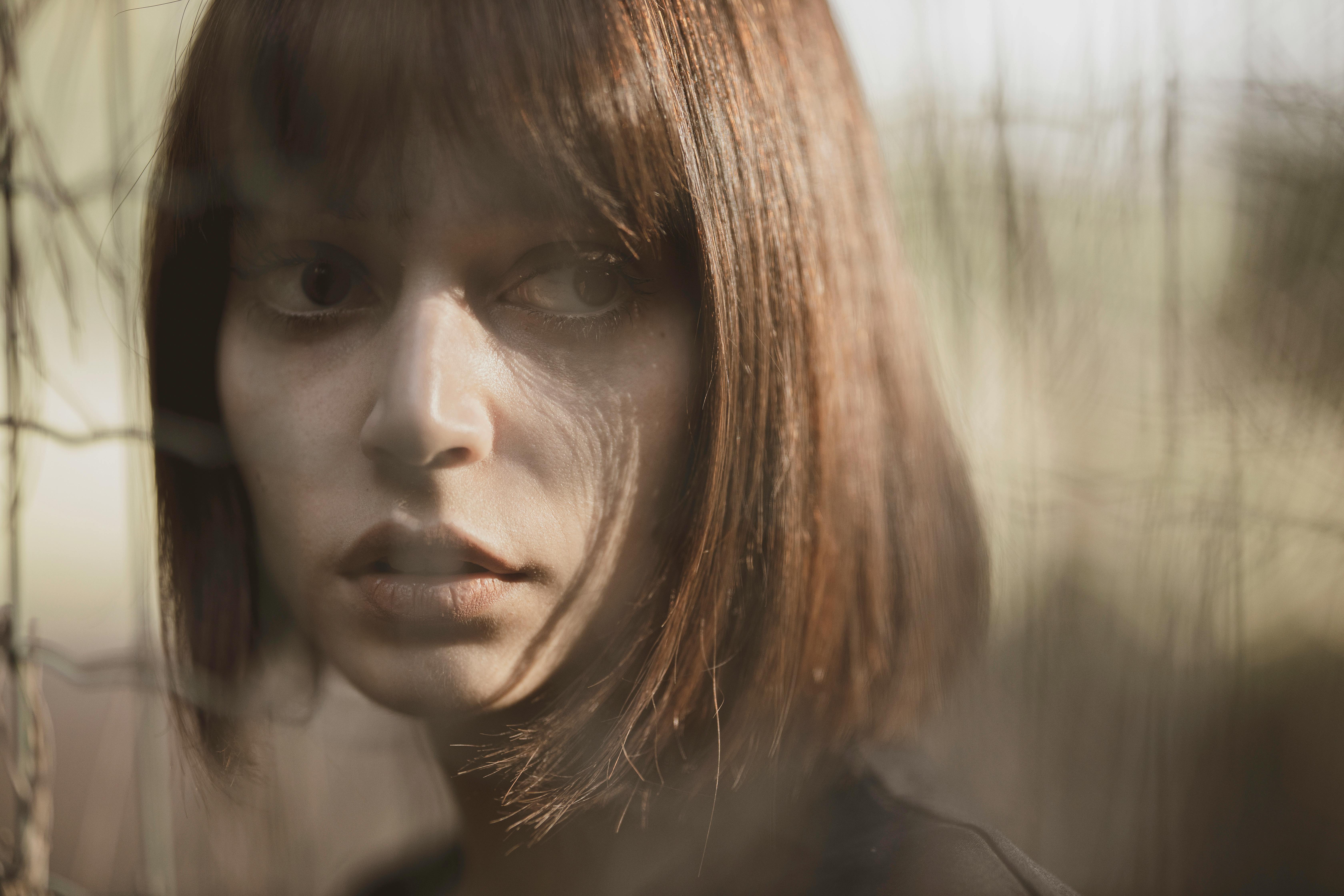 close up photography of a woman s face