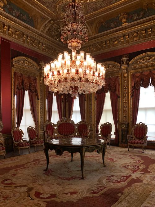 Free Lavish interior room in an Ottoman palace with ornate chandelier and rich decor. Stock Photo