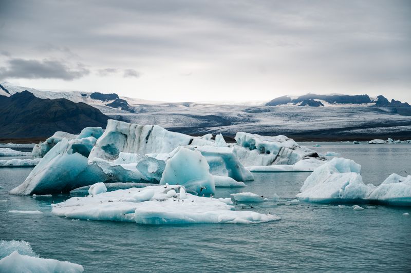 Breathtaking view of icebergs floating on Jökulsárlón Lagoon in Iceland, showcasing natural beauty.