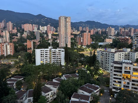 A captivating view of the Medellín skyline at sunrise, showcasing the city's urban and natural landscapes.