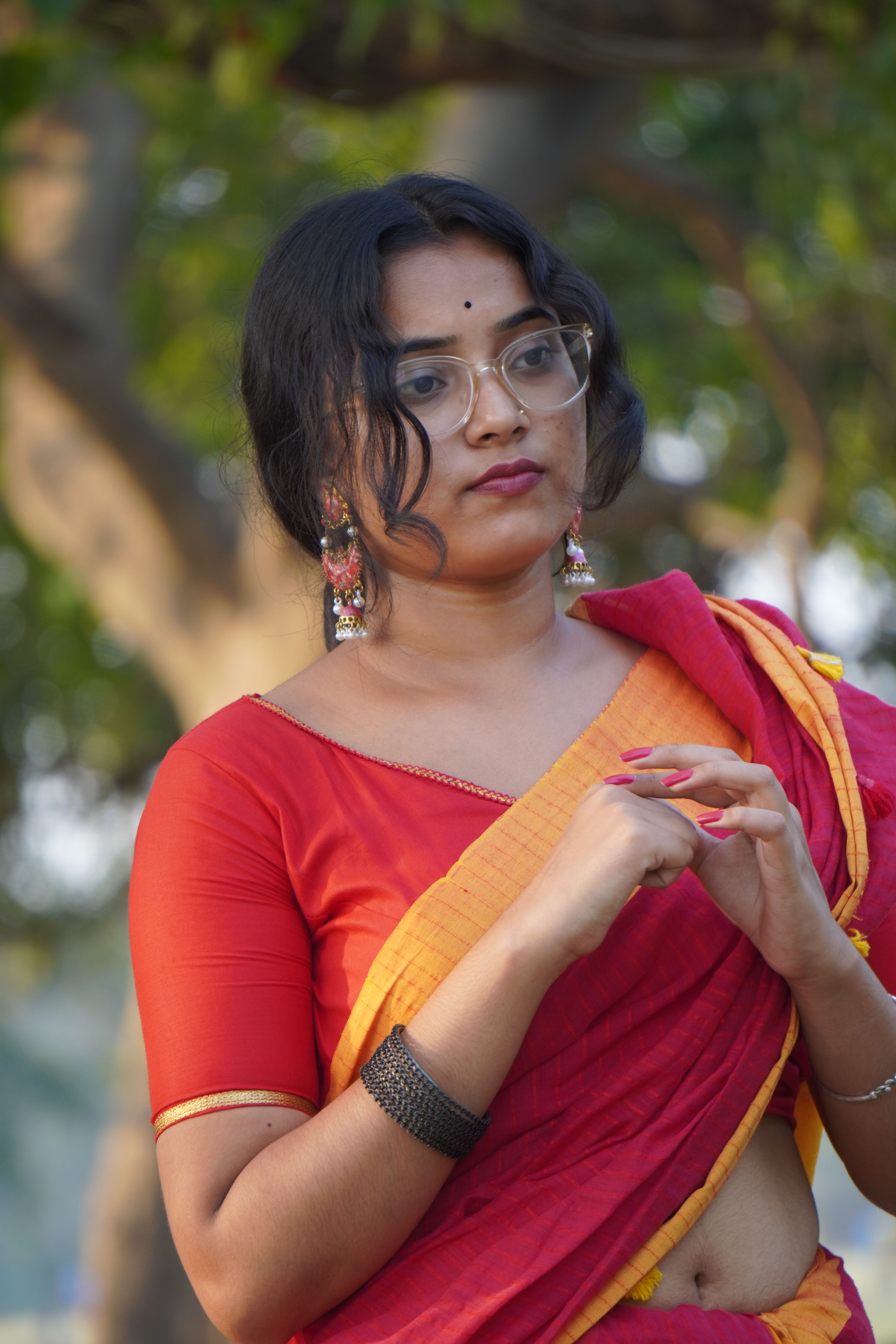 Elegant Woman in Traditional Red Saree Portrait · Free Stock Photo
