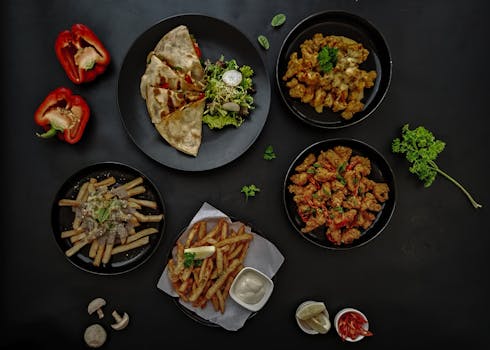 A flat lay showcasing an appetizing array of gourmet dishes including fries and quesadillas.