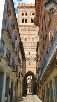 View of a historic Mudejar-style tower in Teruel's charming old town in Spain.