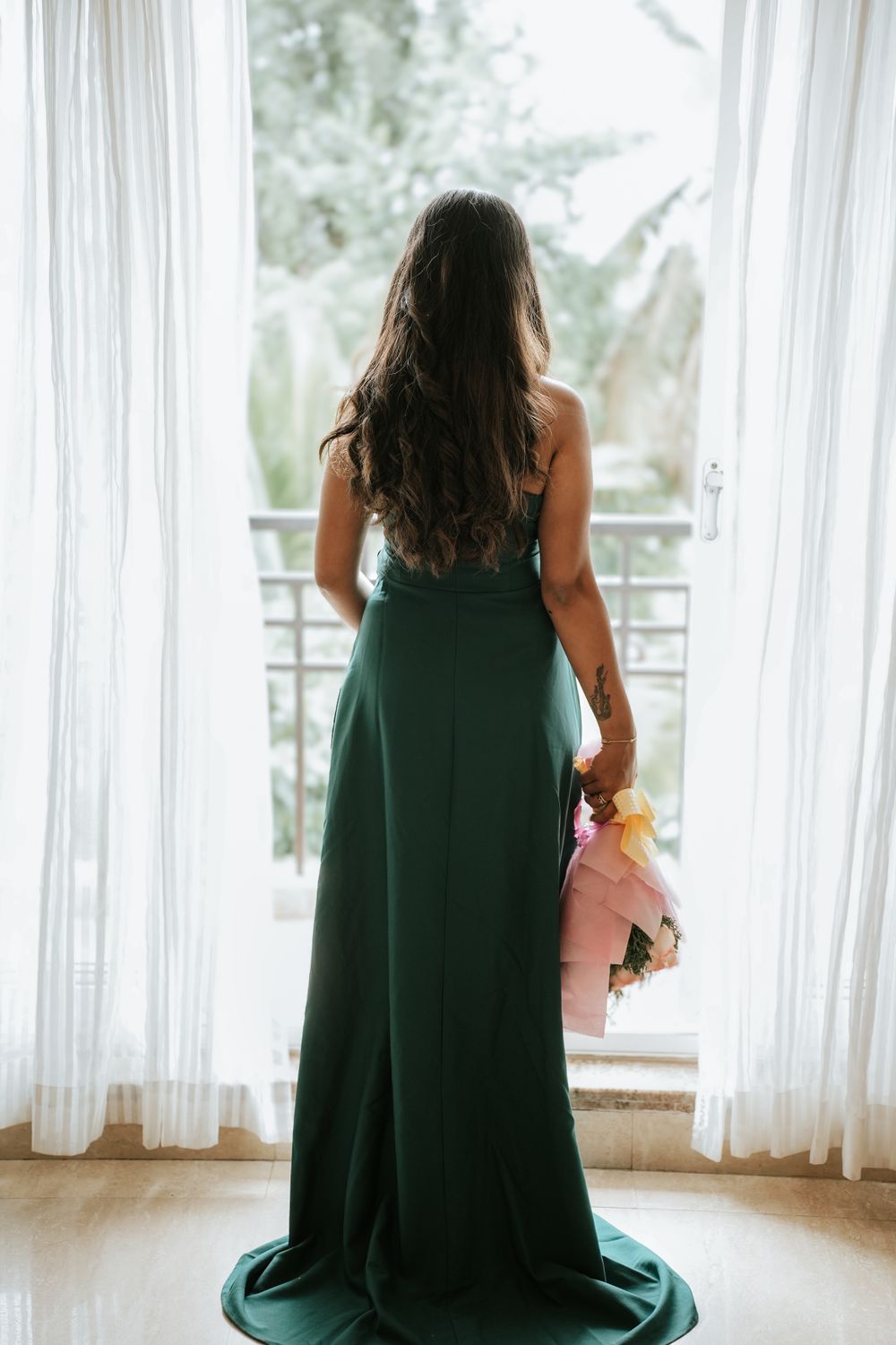 Elegant Woman in Green Dress with Flowers · Free Stock Photo