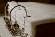 Close-up of a Binder with Documents in Sepia Tone
