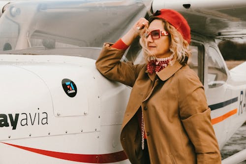 Woman Standing Near Airplane